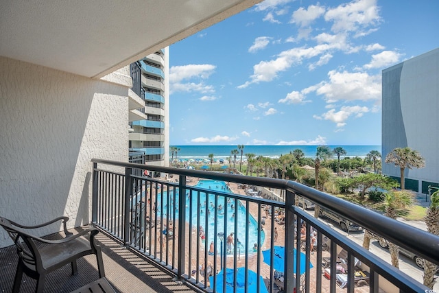 balcony featuring a water view