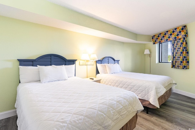 bedroom with wood-type flooring