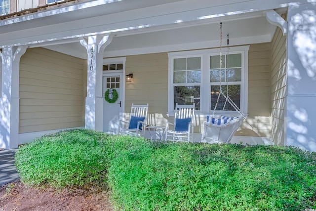 property entrance with covered porch