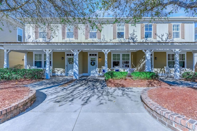 view of property with a porch