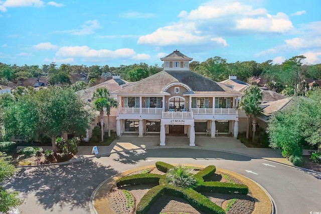 exterior space featuring a carport and a balcony