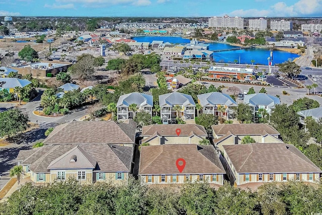 birds eye view of property with a water view