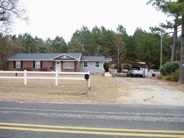 view of front of property featuring a carport