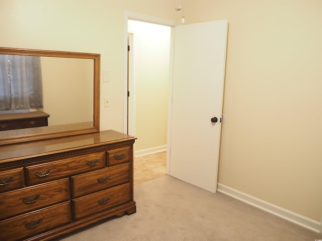 bedroom with light carpet