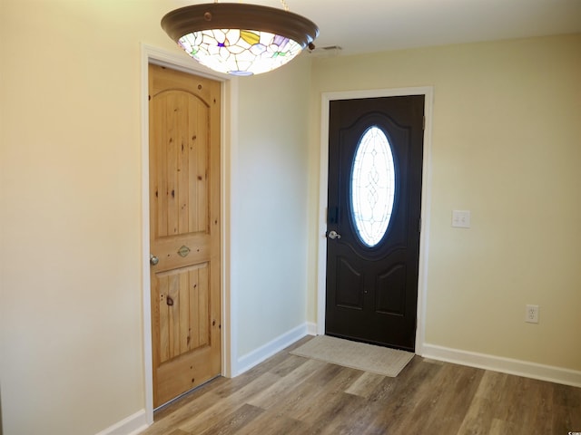 entryway with wood-type flooring