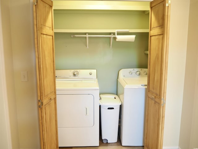 laundry area with independent washer and dryer