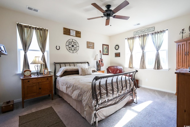 bedroom featuring dark carpet and ceiling fan