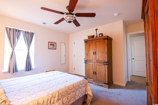 bedroom with light colored carpet and ceiling fan