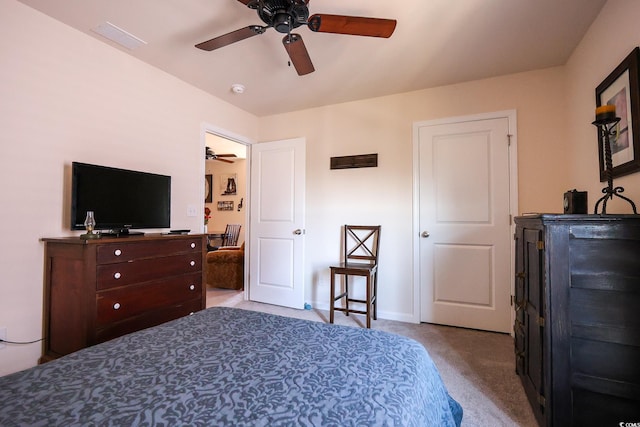 bedroom featuring light colored carpet and ceiling fan