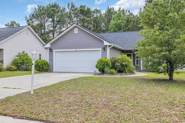 view of front facade with a garage, driveway, and a front lawn