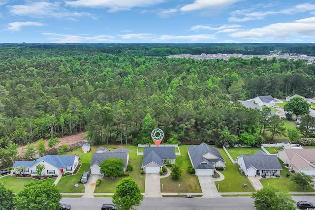 aerial view of residential area with a forest