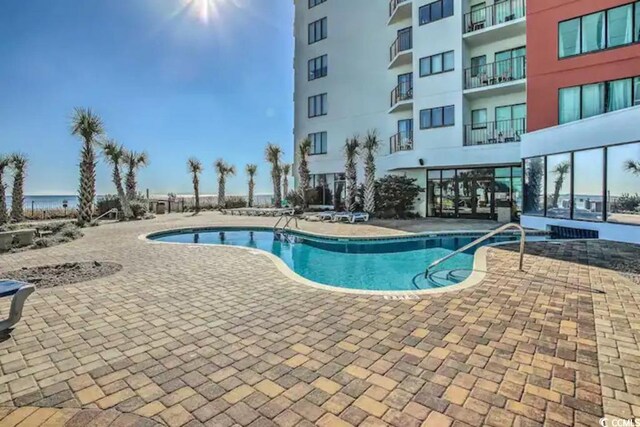 1605 S Ocean Blvd Unit 1602, Myrtle Beach, SC 29577 - view of swimming pool featuring a patio area