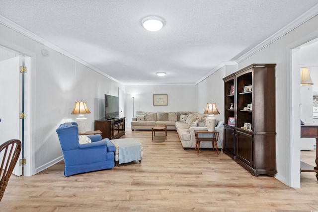 living room with a textured ceiling, light hardwood / wood-style flooring, and ornamental molding