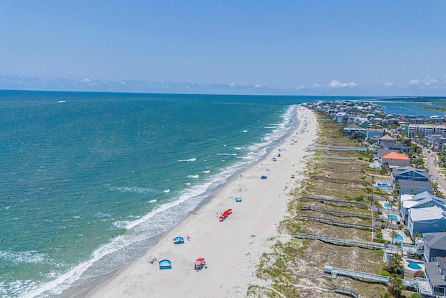 aerial view featuring a water view and a view of the beach