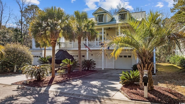 view of front of home with a garage and a balcony