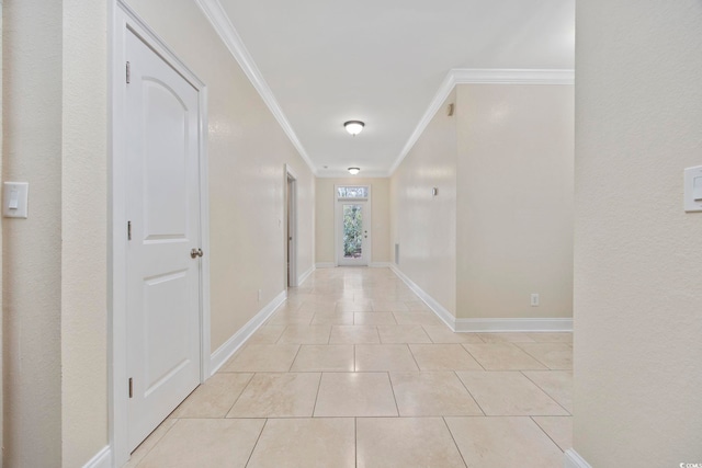 hallway with crown molding and light tile patterned flooring