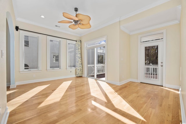 interior space featuring crown molding, ceiling fan, and light wood-type flooring