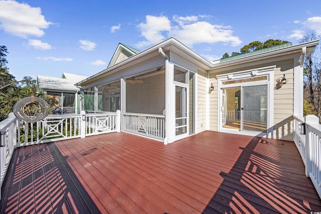 wooden deck with a sunroom