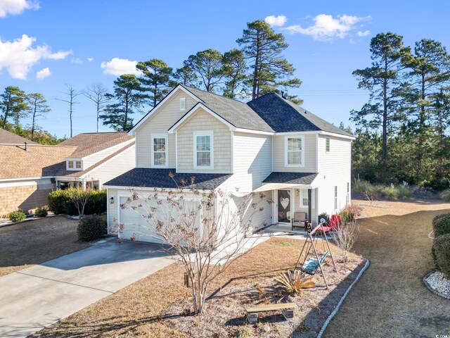 front facade with a garage and central AC