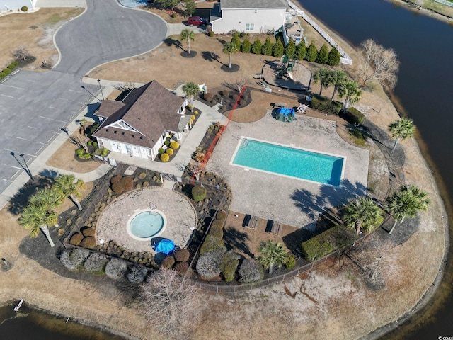 birds eye view of property with a water view