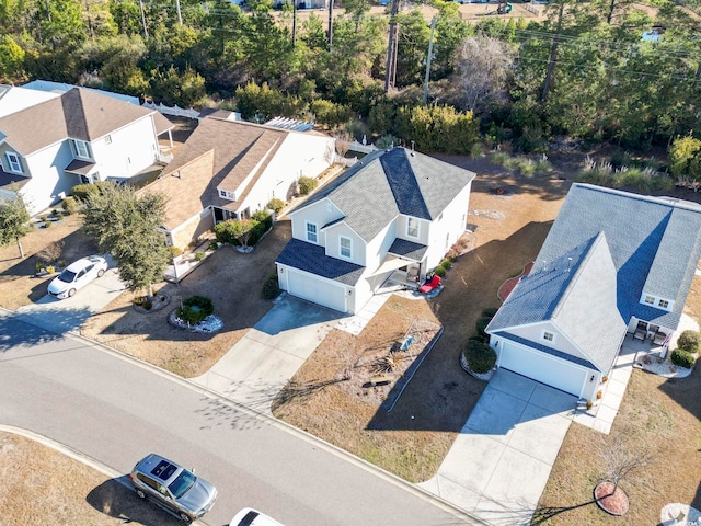 birds eye view of property with a residential view