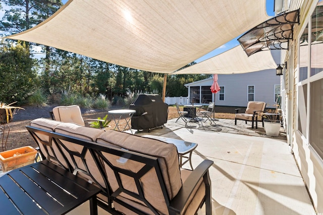 view of patio with outdoor dining space and area for grilling