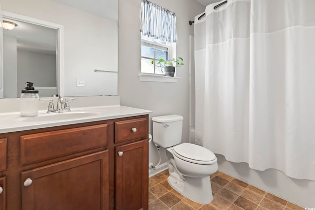 bathroom featuring vanity, toilet, and shower / tub combo with curtain