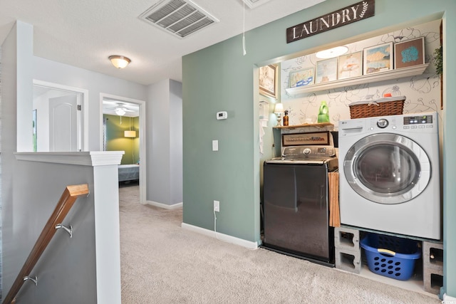 laundry room with attic access, baseboards, visible vents, washing machine and clothes dryer, and carpet flooring