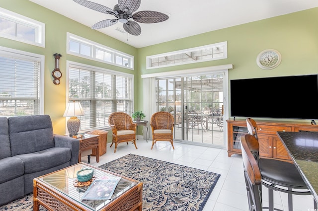 living room featuring ceiling fan and light tile patterned flooring