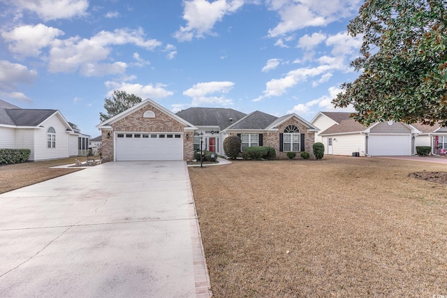 ranch-style home with a garage and a front lawn