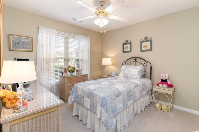 bedroom with ceiling fan and light carpet