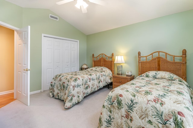 bedroom featuring a closet, ceiling fan, carpet floors, and lofted ceiling