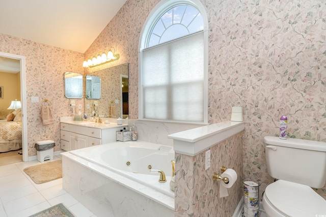 bathroom featuring tile patterned floors, tiled tub, toilet, vanity, and lofted ceiling