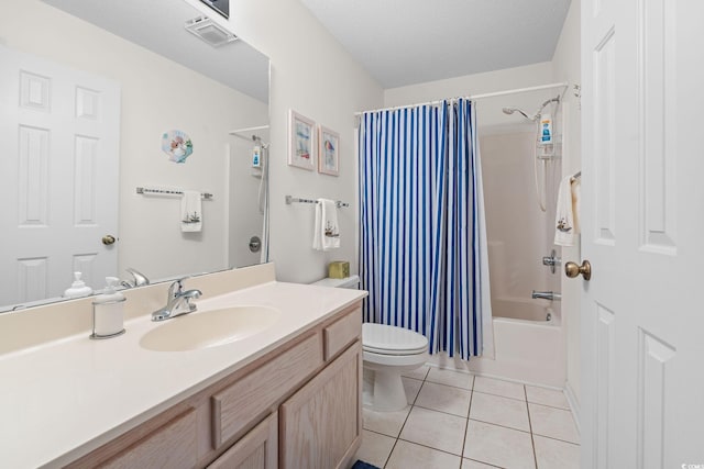 full bathroom featuring tile patterned floors, toilet, a textured ceiling, vanity, and shower / bath combo