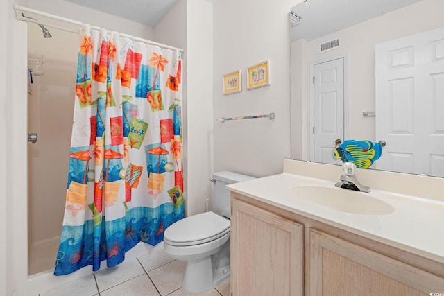 bathroom with vanity, walk in shower, tile patterned floors, and toilet