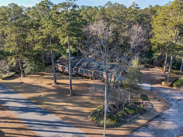 bird's eye view featuring a forest view
