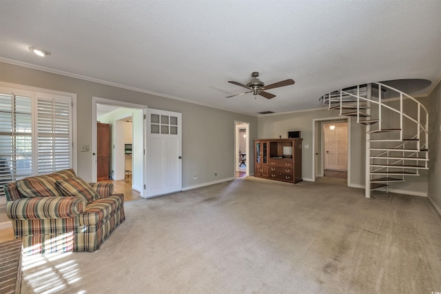 unfurnished living room featuring a ceiling fan, baseboards, ornamental molding, stairs, and light carpet