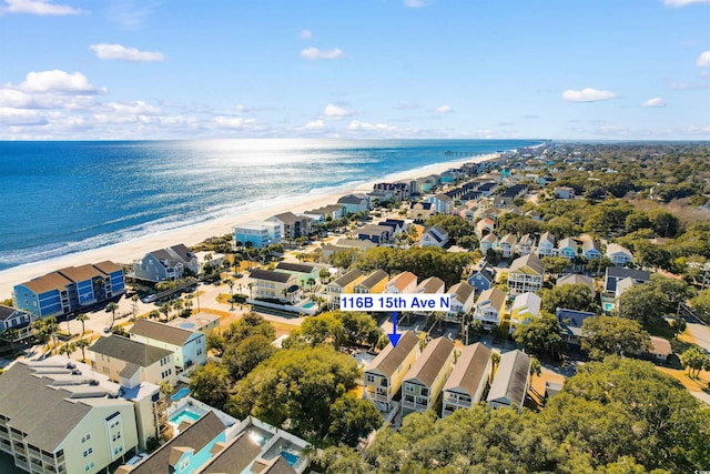 aerial view with a water view and a view of the beach