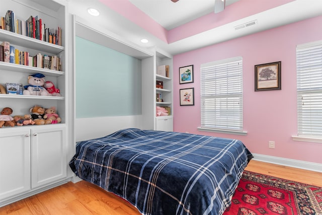 bedroom featuring light hardwood / wood-style flooring and ceiling fan