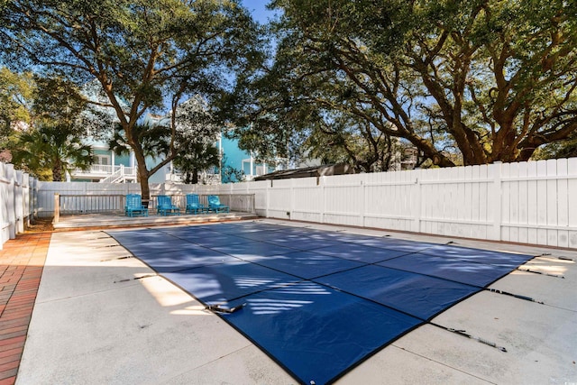 view of swimming pool featuring a patio