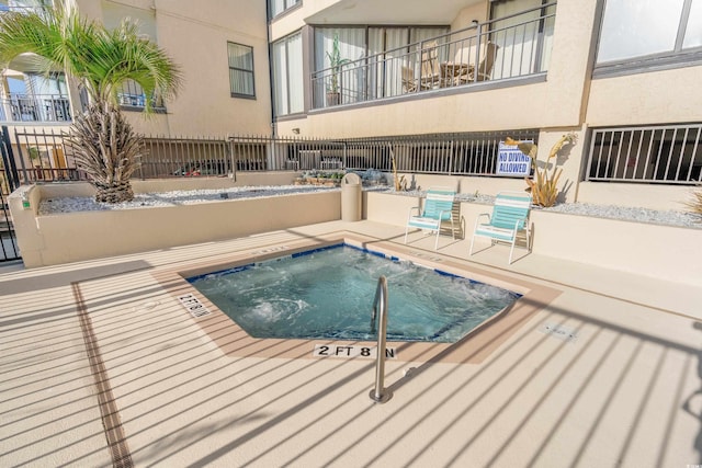 view of pool featuring a patio area and a community hot tub