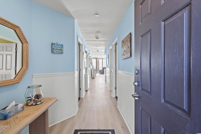 corridor featuring light hardwood / wood-style floors