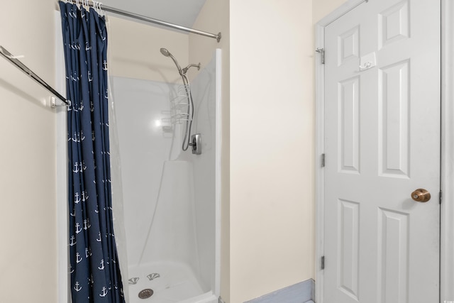 bathroom with a shower with curtain