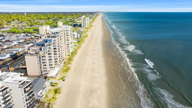 aerial view featuring a water view and a beach view