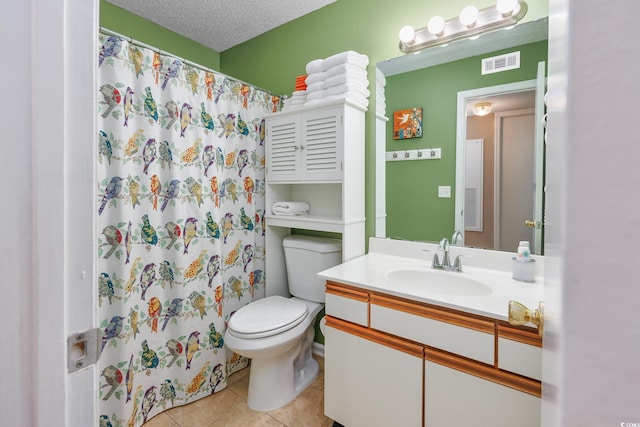 bathroom featuring vanity, toilet, tile patterned floors, a textured ceiling, and a shower with shower curtain