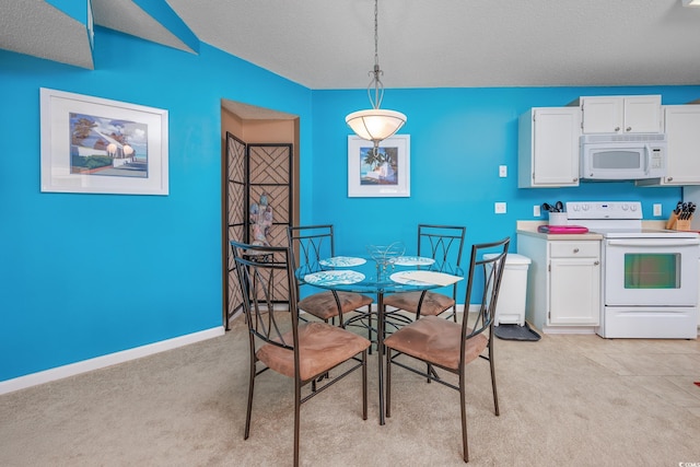 dining room with a textured ceiling