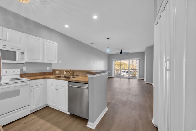 kitchen with white cabinetry, a sink, and appliances with stainless steel finishes