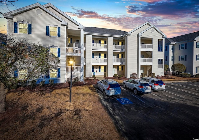 view of outdoor building at dusk