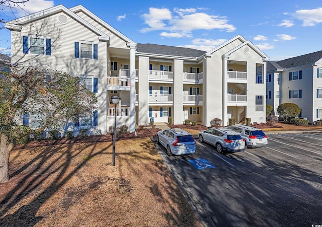 901 W Port Dr Unit 1706, North Myrtle Beach, SC 29582 - view of building exterior with uncovered parking