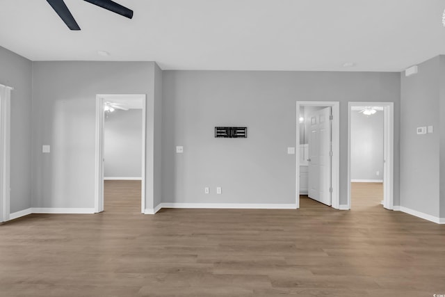901 W Port Dr Unit 1706, North Myrtle Beach, SC 29582 - unfurnished living room with wood finished floors, baseboards, and ceiling fan
